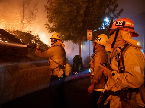 Firefighters battle the Saddleridge fire in Sylmar, Calif., Thursday, Oct. 10, 2019.