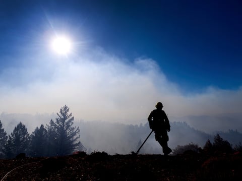 Firefighter Josh Petrell monitors the Kincade Fire burning near Healdsburg, Calif., on Tuesday, Oct. 29, 2019. The overall weather picture in northern areas is improving as powerful, dry winds bring extreme fire weather to Southern California.
