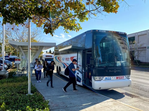 Commuters board the UC Davis shuttle at a stop at the Med Center in Sacramento.