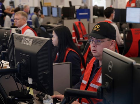 Pacific Gas & Electric employees work in the PG&E Emergency Operations Center in San Francisco, Thursday, Oct. 10, 2019.