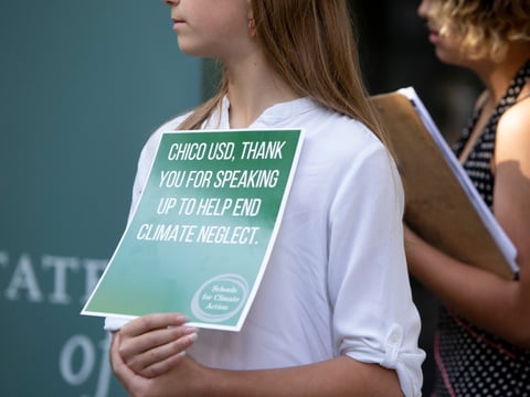 Students from Sonoma County speak at a press conference in front of the California Department of Education, urging lawmakers to recognize the effects of climate change on education.