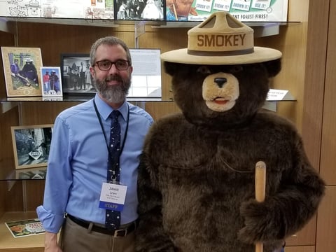 James Lewis and Smokey Bear strike a pose.