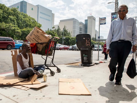 Will, who provided his first name only, panhandles on the sidewalk across the street from LAC+USC Medical Center.
