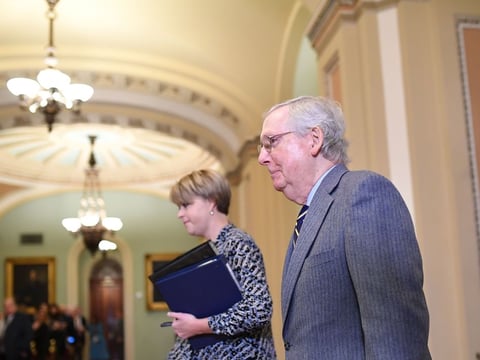 Senate Majority Leader Mitch McConnell walks back to the Senate chamber after a break for the closing arguments in the impeachment trial of President Trump on Monday.