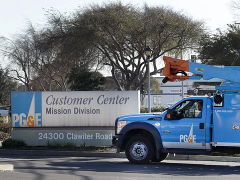 In this photo taken on Wednesday, Jan. 23, 2019, a Pacific Gas & Electric repair truck enters their customer center in Hayward, Calif.