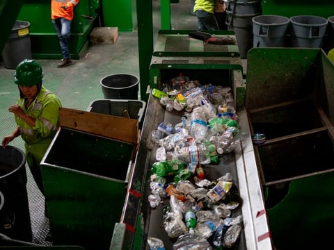 Plastic bottles on a conveyor belt at GreenWaste Recovery's facility in San Jose on July 29, 2019.