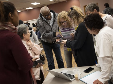 Nevada caucus volunteers receive training for recording results Thursday in Las Vegas.