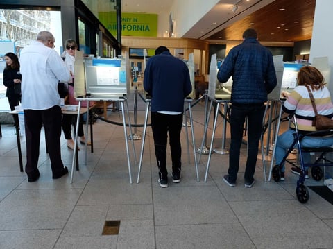 Voters cast ballots in-person at the California Museum in Sacramento March 3, 2020.