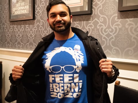 Talha Javed shows his support for Bernie Sanders at an election returns watch party in Downtown Sacramento on March 3, 2020.