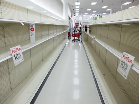 The shelves of a Target in Arden-Arcade sit cleared out of toilet paper on Friday, March 13, 2020.