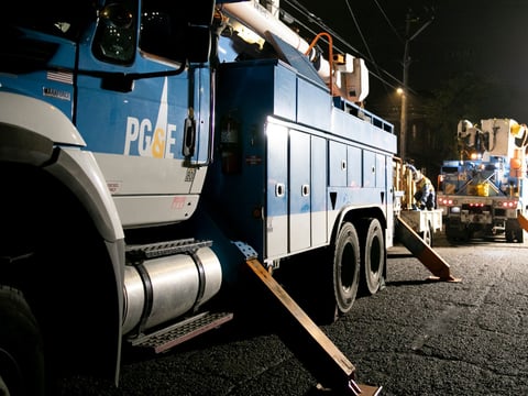 PG&E employees work to replace a nearly 100-year-old utility pole in Berkeley last year.
