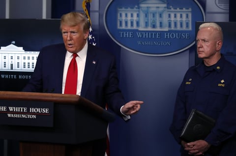 Adm. Brett Giroir, assistant secretary of Health and Human Services, listens as President Trump speaks about the coronavirus on April 6, 2020.