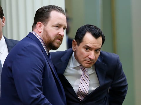 Assemblyman Devon Mathis, R-Porterville, left, talks with Assembly Speaker Anthony Rendon, D-Lakewood, as the Assembly discusses the state budget in Sacramento, Calif., Thursday, June 13, 2019.