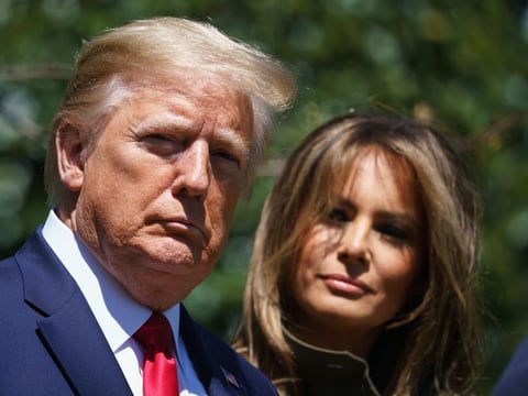 President Trump and First Lady Melania Trump are seen during a tree planting to mark Earth Day at the White House Wednesday.