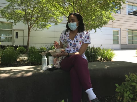 Gina Maxwell, who works in a lab at UC Davis Medical Center,  grabbed lunch from a food truck that served 700 health workers Friday. A new group is raising money to provide free meals essential employees.