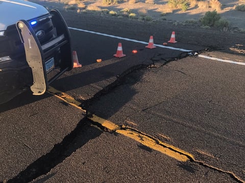 Cracked pavement on a road north of the US Route 6 junction in Tonopah, Nevada following an earthquake nearby