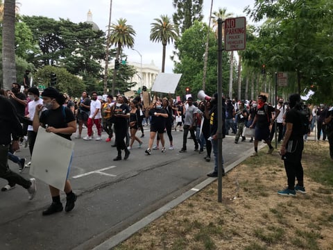 Protesters march through downtown Sacramento on Sunday evening.