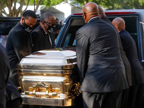 George Floyd's casket is loaded into a hearse after being brought out of Fountain of Praise church following a public visitation Monday, June 8, 2020, in Houston. Floyd died May 25 after being restrained by Minneapolis police.