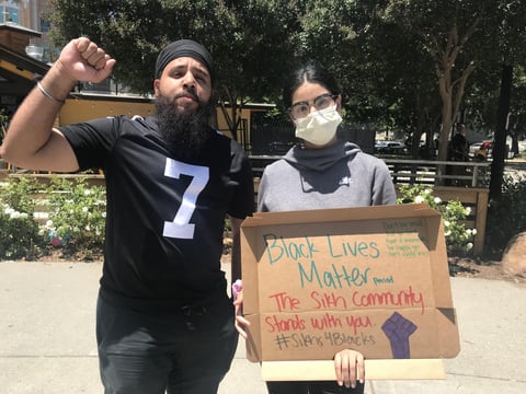 Gurbir Goraya (left) and Manpreet Kaur attended a Sikh community rally in Sacramento on Sunday in support of the Black Lives Matter movement.