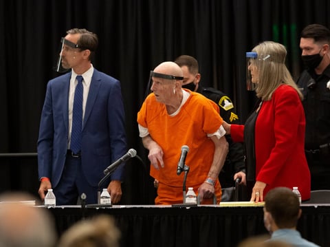 Joseph James DeAngelo, center, charged with being the Golden State Killer, his helped up by his attorney, Diane Howard, as Sacramento Superior Court Judge Michael Bowman enters the courtroom in Sacramento. Monday June 29, 2020.