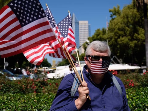 People gathered at the California Capitol to protest the state's stay-at-home order to prevent the spread of COVID-19 on Friday, May 1, 2020.