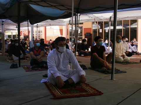Sacramento-area Muslims prayed six feet apart outside the Salam Islamic Center during the start of Eid al-Adha celebrations Friday.