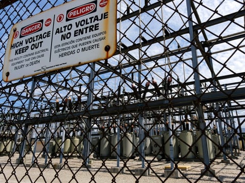 High voltage signs are posted on the Department of Water and Power sub station E in the North Hollywood section of Los Angeles on Saturday, Aug. 15, 2020.