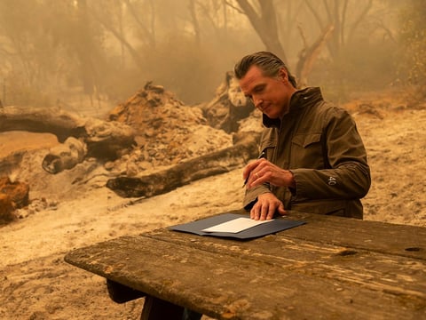 Newsom signs Assembly Bill 2147 after he toured the North Complex Fire zone on Friday. The bill allows inmates who have worked as firefighters to ask the court to dismiss their charges to make it easier for them to find a job once they are released.