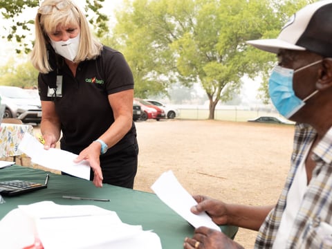 River City Food Bank CalFresh Outreach Director Amy Dierlam assists Kissete Gebremicial with a CalFresh application in Arden Arcade on Friday, Sept 11, 2020.