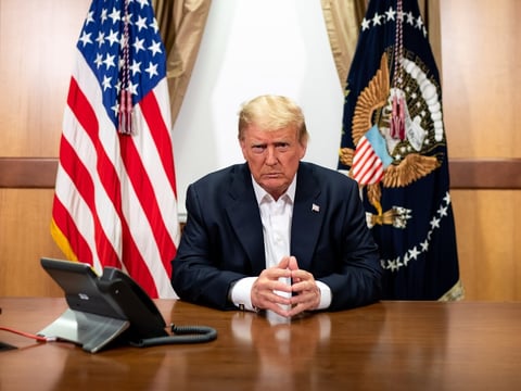 President Trump participates in a conference call at Walter Reed National Military Medical Center on Sunday.