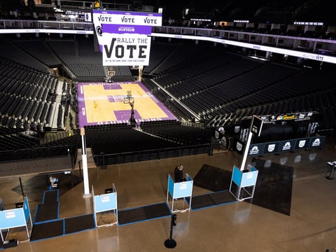 A voter uses a touchscreen at the Golden1 Center in Sacramento, Saturday, Oct. 24, 2020.