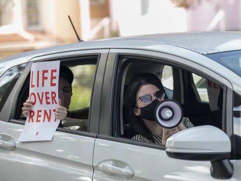 Demonstrators participate in a caravan along Harrison Street in Oakland to protest rent payment and evictions during the coronavirus pandemic on Dec. 5, 2020.