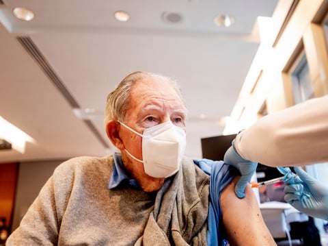 Ken Towns receives a first dose of Pfizer-BioNTech COVID-19 vaccine from UC Davis Health on Tuesday, Jan. 12, 2021, in Sacramento, Calif.