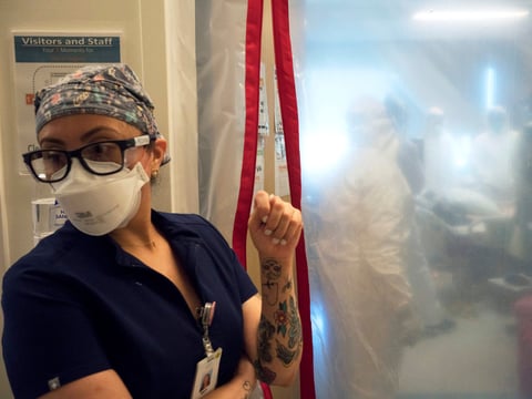 Maria Arechiga, an ICU charge nurse, monitors the progress of two COVID-19 patients in the intensive care unit of Martin Luther King Jr. Community Hospital in Los Angeles.
