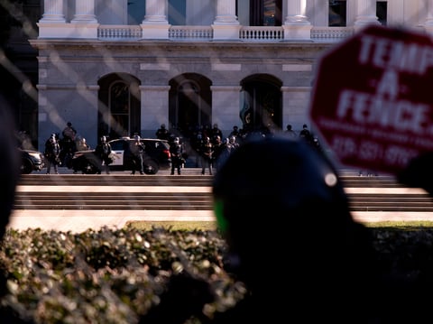 Antifa and anti-racist protesters rally on Jan. 20, 2021, at the state Capitol in Sacramento, where hundreds of California Highway Patrol officers are staged after Pro-Trump extremists stormed the nation’s Capitol in Washington, D.C.