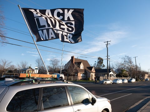 A car is ready for the MLK Day car caravan to start in Sacramento, Monday, Jan. 18 2021.