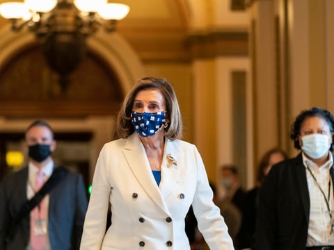 House Speaker Nancy Pelosi of Calif., walks from the House floor during the vote on the $1.9 trillion COVID-19 relief bill Wednesday. Despite Republican criticism, Pelosi insisted the bill is "coronavirus-centric."