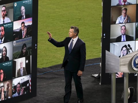 Gov. Newsom waves to virtual guests during the State of the State address at Dodger Stadium on March 9, 2021.