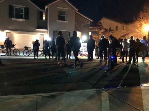 Demonstrators gather near the home of City Manager Howard Chan March 28, 2021.