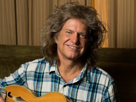 Pat Metheny plays many styles of guitar.