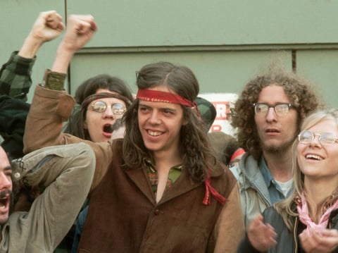 Protesters who have just been arrested during the 1971 "May Day" demonstrations continue to shout their opposition to the war in Vietnam.