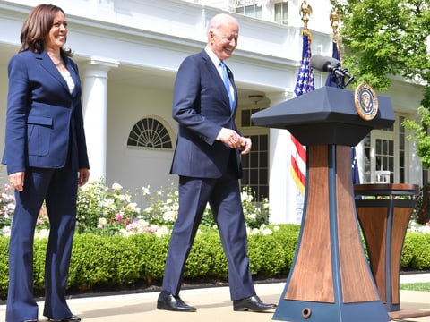 President Biden arrives with Vice President Harris to discuss the CDC's new mask guidance in the Rose Garden of the White House on Thursday.