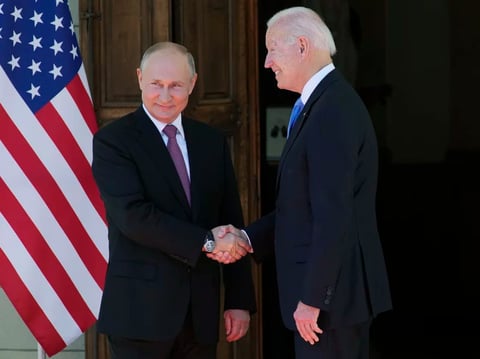 Russian President Vladimir Putin and U.S President Biden shake hands during their meeting at the Villa la Grange in Geneva on Wednesday.