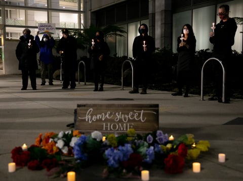 Housing activists and rent strikers participate in a vigil for tenants who they say will not be covered by Gov. Gavin Newsom’s rent relief plan at the Elihu M. Harris, State of California office building in Oakland on Jan. 29, 2021.