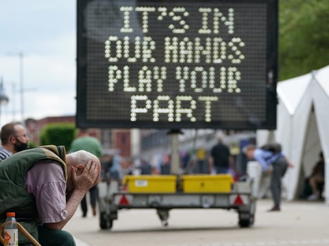 A mobile COVID-19 vaccination center in Bolton, U.K., sends a message earlier this month. Variants that were first found in various places are wreaking havoc on the global fight to control this coronavirus.