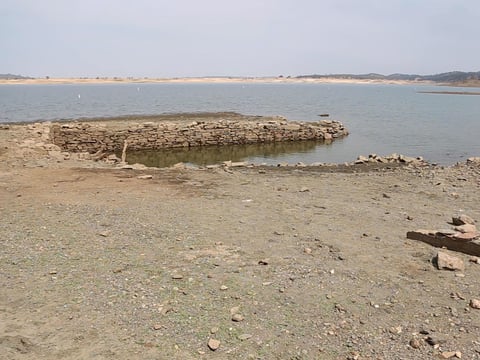 The foundation of what is believed to have been a winery in the Gold Rush era town of Red Bank is exposed due to low lake levels at Folsom Lake, Thursday, July 29, 2021.