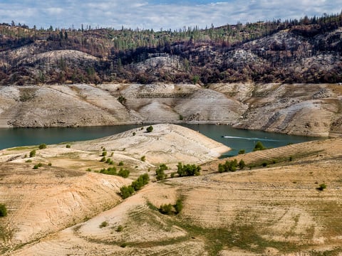A boat crosses Lake Oroville on May 23, 2021. At the time, the reservoir was at 39% of capacity and 46% of its historical average, creating water shortages.