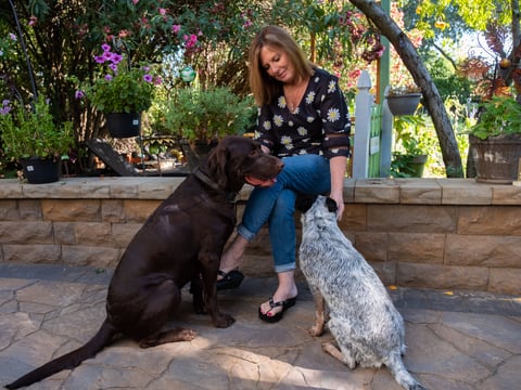 Kris Pedretti sits with her Dogs Cello and Lexi at her Elk Grove home.