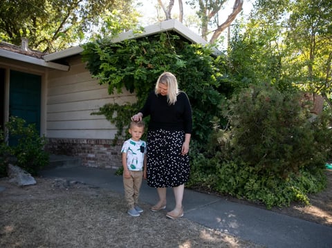 Elizabeth Olson and her son, Lucas, 2, in front of their newly-purchased home in the Land Park neighborhood of Sacramento on Aug. 4. 2021.
