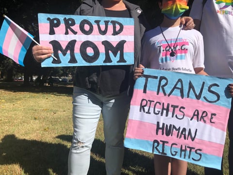 One family from Sacramento came to the march, carrying signs that expressed support for trans people — including their son.